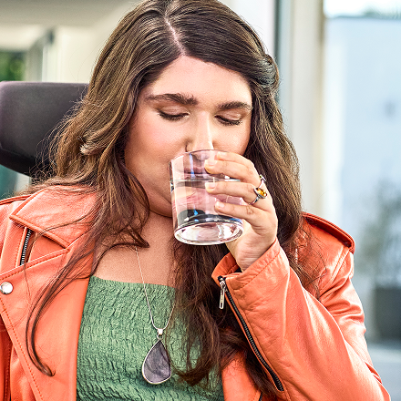 Lyza drinking a glass of water